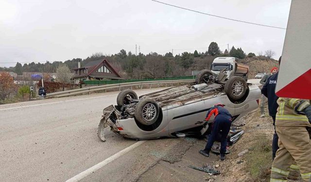Takla atan otomobilden yara almadan kurtuldu
